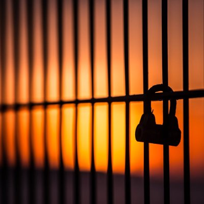 moody photograph at sunset of a locked padlock
